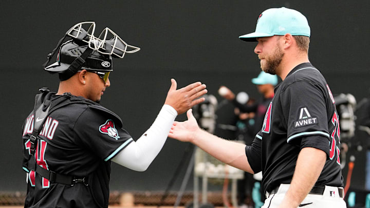 Arizona Diamondbacks catcher Gabriel Moreno greets new pitcher Corbin Burnes after throwing in the bullpen on the first day of spring training practice at Salt River Fields at Talking Stick in Scottsdale on Feb. 12, 2025. Arizona Diamondbacks catcher Gabriel Moreno greets new pitcher Corbin Burnes after throwing in the bullpen on the first day of spring training practice at Salt River Fields at Talking Stick in Scottsdale on Feb. 12, 2025.