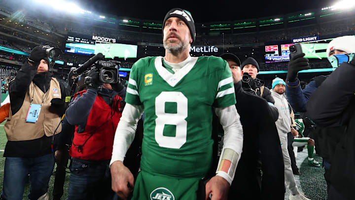 Jan 5, 2025; East Rutherford, New Jersey, USA; New York Jets quarterback Aaron Rodgers (8) walks on the field after the Jets win over the Miami Dolphins at MetLife Stadium.