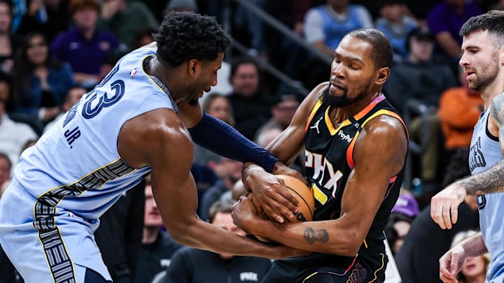 Dec 31, 2024; Phoenix, Arizona, USA; Memphis Grizzlies forward-center Jaren Jackson Jr. (13) attempts to take the ball from Phoenix Suns forward Kevin Durant (35) during the third quarter of the game at Footprint Center. Mandatory Credit: Aryanna Frank-Imagn Images Dec 31, 2024; Phoenix, Arizona, USA; Memphis Grizzlies forward-center Jaren Jackson Jr. (13) attempts to take the ball from Phoenix Suns forward Kevin Durant (35) during the third quarter of the game at Footprint Center. Mandatory Credit: Aryanna Frank-Imagn Images