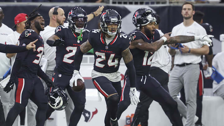 Dec 15, 2024; Houston, Texas, USA; Houston Texans cornerback Derek Stingley Jr. (24) reacts after an interception during the game against the Miami Dolphins at NRG Stadium.