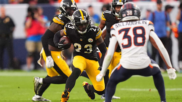 Sep 15, 2024; Denver, Colorado, USA; Pittsburgh Steelers safety Damontae Kazee (23) returns a intercepted football in the fourth quarter against the Denver Broncos at Empower Field at Mile High. Mandatory Credit: Ron Chenoy-Imagn Images