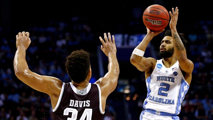 Mar 18, 2018; Charlotte, NC, USA; North Carolina Tar Heels guard Joel Berry II (2) shoots the ball against Texas A&M Aggies center Tyler Davis (34) during the second half in the second round of the 2018 NCAA Tournament at Spectrum Center. Mandatory Credit: Jeremy Brevard-Imagn Images