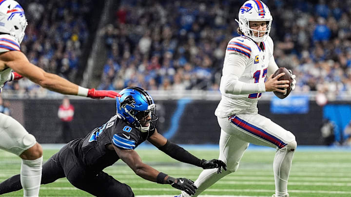 Buffalo Bills quarterback Josh Allen (17) runs against Detroit Lions cornerback Terrion Arnold (0).