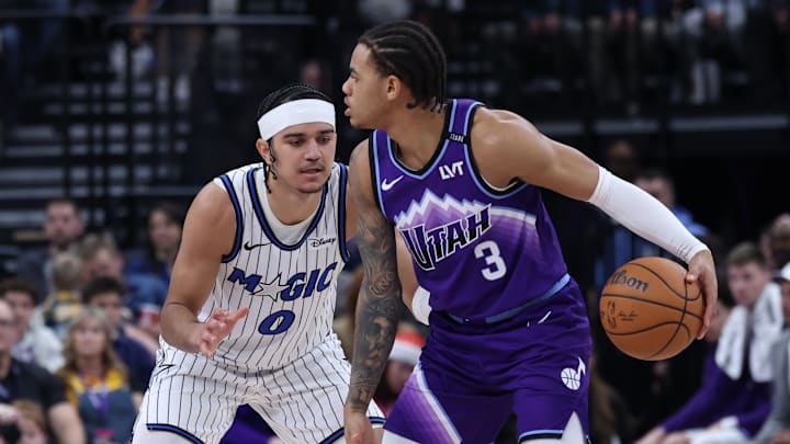 Dec 20, 2025; Salt Lake City, Utah, USA; Utah Jazz guard Keyonte George (3) dribbles the ball as Orlando Magic guard Anthony Black (0) defends during the second quarter at Delta Center. Mandatory Credit: Rob Gray-Imagn Images