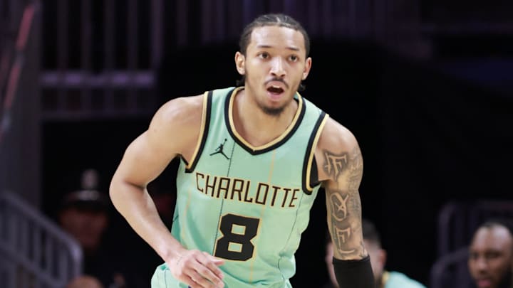 Mar 23, 2025; Miami, Florida, USA;  Charlotte Hornets guard Nick Smith Jr. (8) brings the ball up court against the Miami Heat during the first half at Kaseya Center. Mandatory Credit: Rhona Wise-Imagn Images