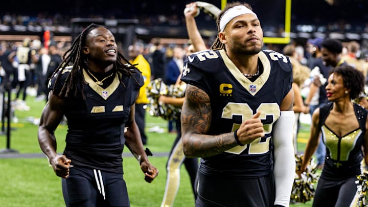 Sep 8, 2024; New Orleans, Louisiana, USA;  New Orleans Saints safety Tyrann Mathieu (32) and running back Alvin Kamara (41) head to the locker room after the game against the Carolina Panthers at Caesars Superdome. Mandatory Credit: Stephen Lew-Imagn Images