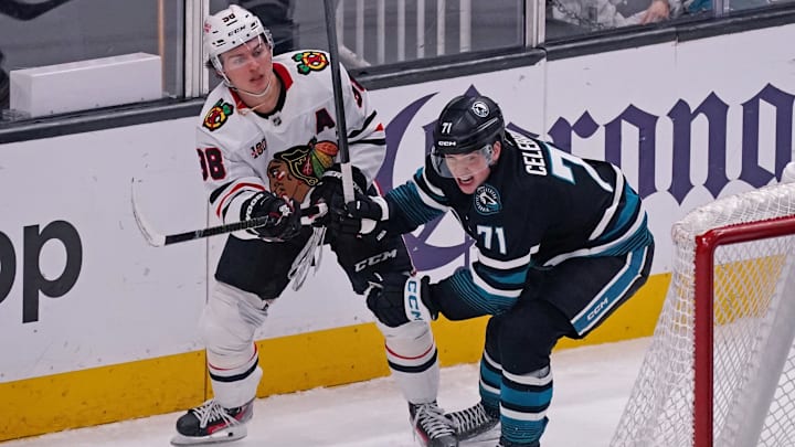 Apr 6, 2026; San Jose, California, USA;  San Jose Sharks center Macklin Celebrini (71) battles with Chicago Blackhawks center Connor Bedard (98) 