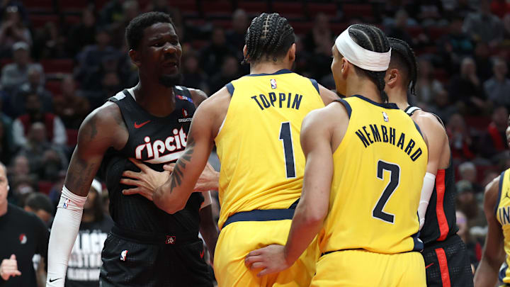 Feb 4, 2025; Portland, Oregon, USA; Portland Trail Blazers center Deandre Ayton (2) talks with Indiana Pacers forward Obi Toppin (1) and Pacers’ guard Andrew Nembhard (2)  in the second half at Moda Center. Mandatory Credit: Jaime Valdez-Imagn Images