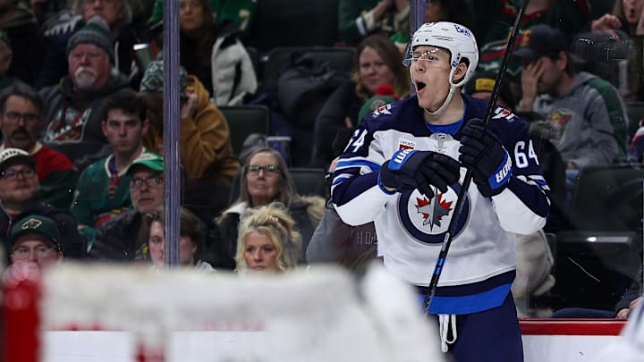 Jan 15, 2026; Saint Paul, Minnesota, USA; Winnipeg Jets defenseman Logan Stanley (64) celebrates his goal against the Minnesota Wild during the second period at Grand Casino Arena. Mandatory Credit: Matt Krohn-Imagn Images