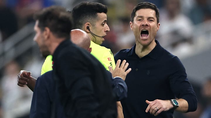 Xabi Alonso (right) lost his signature cool with Diego Simeone on Thursday night. Xabi Alonso (right) lost his signature cool with Diego Simeone on Thursday night.