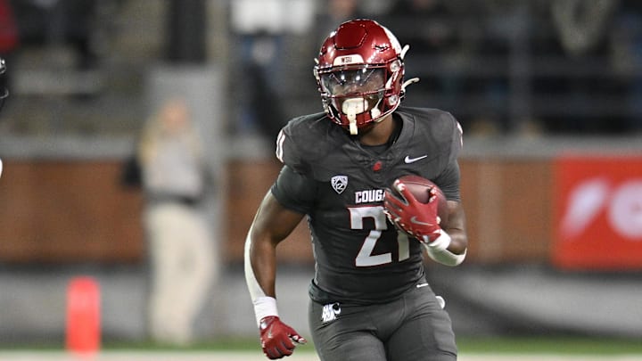 Nov 9, 2024; Pullman, Washington, USA; Washington State Cougars running back Wayshawn Parker (21) runs the ball against the Utah State Aggies in the second half at Gesa Field at Martin Stadium. Mandatory Credit: James Snook-Imagn Images Nov 9, 2024; Pullman, Washington, USA; Washington State Cougars running back Wayshawn Parker (21) runs the ball against the Utah State Aggies in the second half at Gesa Field at Martin Stadium. Mandatory Credit: James Snook-Imagn Images