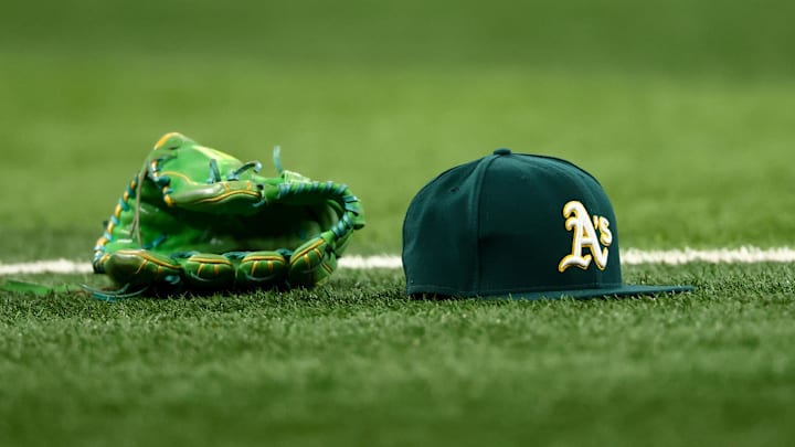 Jul 22, 2025; Arlington, Texas, USA; Athletics glove and hat on the field before the game against the Texas Rangers at Globe Life Field. Mandatory Credit: Kevin Jairaj-Imagn Images Jul 22, 2025; Arlington, Texas, USA; Athletics glove and hat on the field before the game against the Texas Rangers at Globe Life Field. Mandatory Credit: Kevin Jairaj-Imagn Images