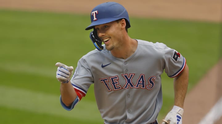 Jun 12, 2025; Minneapolis, Minnesota, USA; Texas Rangers center fielder Evan Carter (32) celebrates his solo home run against the Minnesota Twins in the fifth inning at Target Field. 