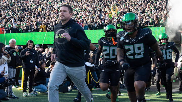 Oregon coach Dan Lanning leads his team onto the field for their game against Southern California Nov. 22, 2025. Oregon coach Dan Lanning leads his team onto the field for their game against Southern California Nov. 22, 2025.