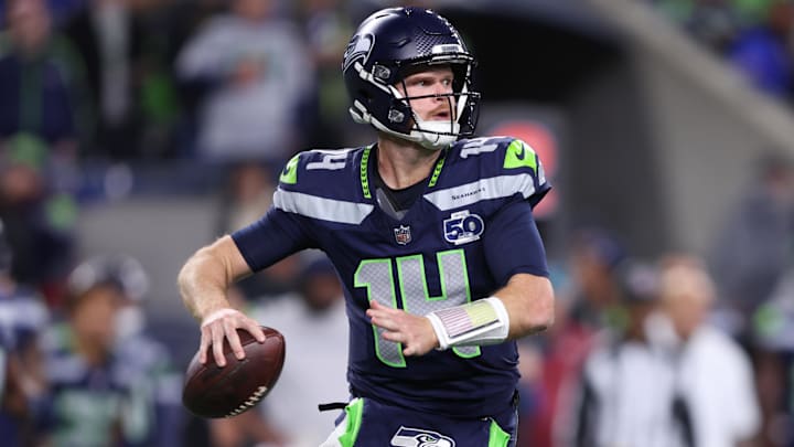 Oct 20, 2025; Seattle, Washington, USA; Seattle Seahawks quarterback Sam Darnold (14) looks to throw a pass during the second quarter against the Houston Texans at Lumen Field. Mandatory Credit: Kevin Ng-Imagn Images