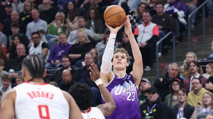 Feb 22, 2025; Salt Lake City, Utah, USA; Utah Jazz forward Lauri Markkanen (23) takes a shot over Houston Rockets forward Amen Thompson (1) during the first half at Delta Center. Mandatory Credit: Rob Gray-Imagn Images