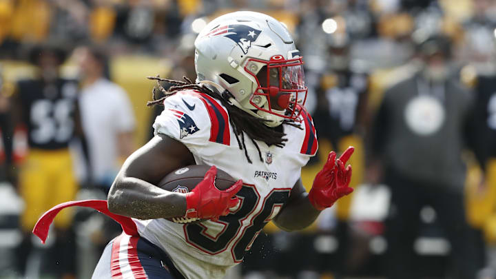 Sep 18, 2022; Pittsburgh, Pennsylvania, USA;  New England Patriots running back Rhamondre Stevenson (38) runs the ball against the Pittsburgh Steelers during the fourth quarter at Acrisure Stadium. The Patriots won 17-14. Mandatory Credit: Charles LeClaire-Imagn Images