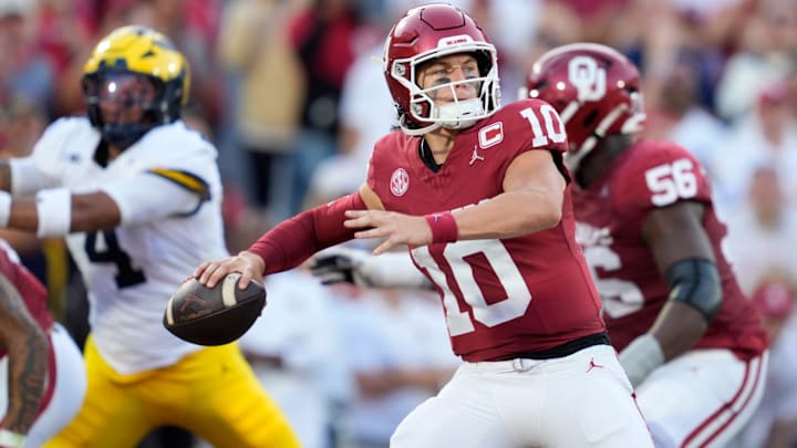 Oklahoma Sooners quarterback John Mateer drops back to pass against Michigan. Oklahoma Sooners quarterback John Mateer drops back to pass against Michigan.