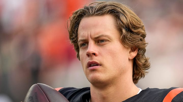 Cincinnati Bengals quarterback Joe Burrow (9) gets loose before the start of the first quarter of the NFL Week 17 game between the Cincinnati Bengals and the Arizona Cardinals at Paycor Stadium in Downtown Cincinnati on Sunday, Dec. 28, 2025. The Bengals led 23-7 at halftime.