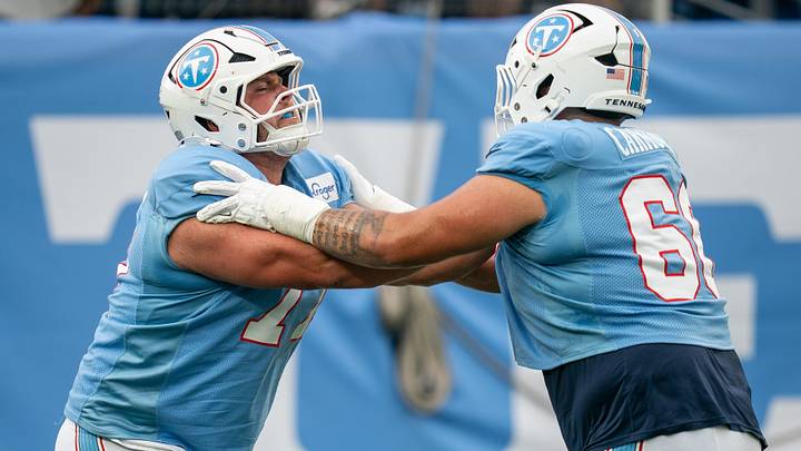 Tennessee Titans offensive lineman Peter Skoronski (77) and guard Fernando Carmona Jr. (66) run drills during the Blue and White Stadium Scrimmage at Nissan Stadium in Nashville, Tenn., Friday, Aug. 7, 2026.