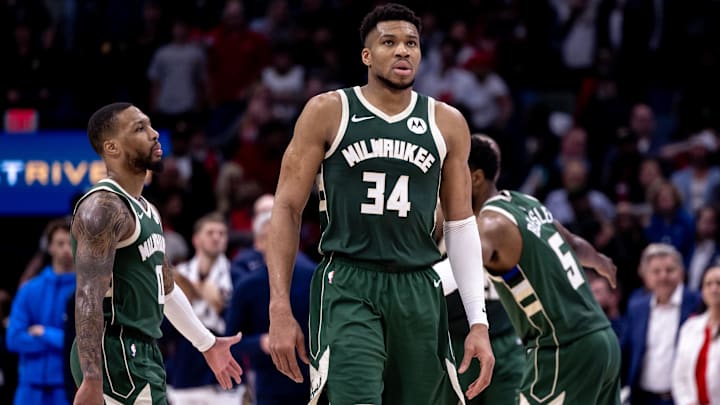 Mar 28, 2024; New Orleans, Louisiana, USA;   Milwaukee Bucks forward Giannis Antetokounmpo (34) and guard Damian Lillard (0) head to the bench on a timer out against the New Orleans Pelicans during the second half at Smoothie King Center. Mandatory Credit: Stephen Lew-Imagn Images
