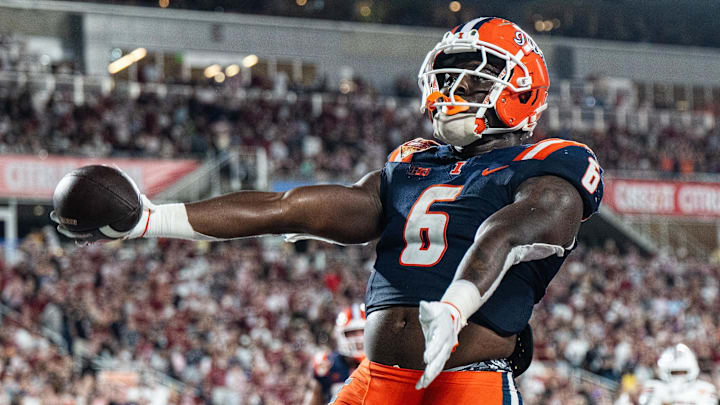 Dec 31, 2024; Orlando, FL, USA; Illinois Fighting Illini running back Josh McCray (6) celebrates his touchdown against the South Carolina Gamecocks in the fourth quarter at Camping World Stadium. Mandatory Credit: Jeremy Reper-Imagn Images