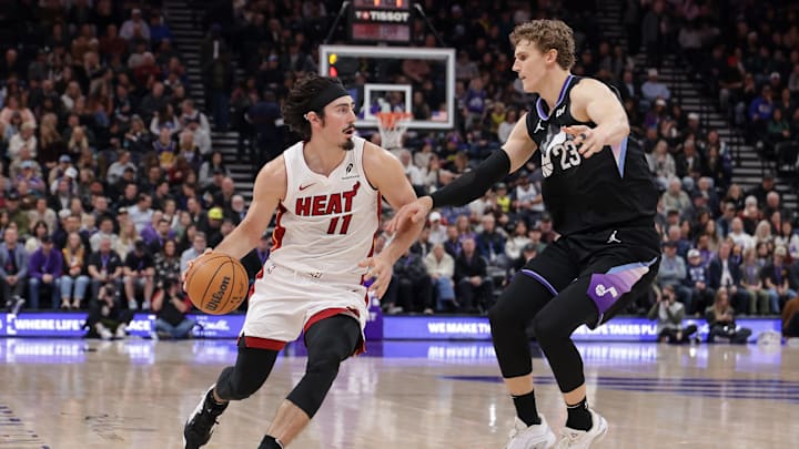 Jan 9, 2025; Salt Lake City, Utah, USA;  Miami Heat guard Jaime Jaquez Jr. (11) dribbles by Utah Jazz forward Lauri Markkanen (23) during the second quarter at Delta Center. Mandatory Credit: Chris Nicoll-Imagn Images