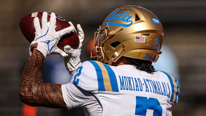 Oct 19, 2024; Piscataway, New Jersey, USA; UCLA Bruins wide receiver Titus Mokiao-Atimalala (2) catches the ball during warm ups before the game against the Rutgers Scarlet Knights at SHI Stadium. Mandatory Credit: Vincent Carchietta-Imagn Images