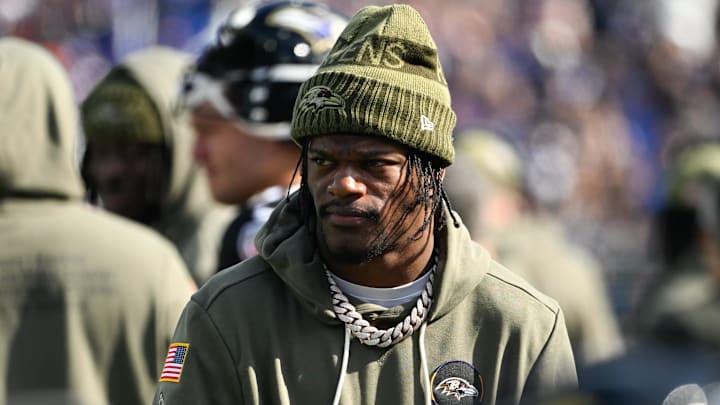 Oct 26, 2025; Baltimore, Maryland, USA; Baltimore Ravens quarterback Lamar Jackson (8) looks on from the sideline during the first quarter against the Chicago Bears at M&T Bank Stadium. Mandatory Credit: Tommy Gilligan-Imagn Images