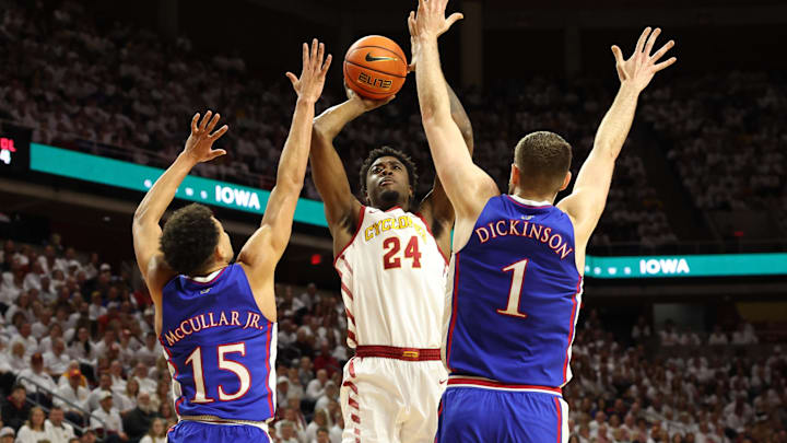 Feb 4, 2023; Ames, Iowa, USA; Iowa State Cyclones forward Hason Ward (24) shoots the ball against Kansas Jayhawks guard Kevin McCullar Jr. (15) and center Hunter Dickinson (1)