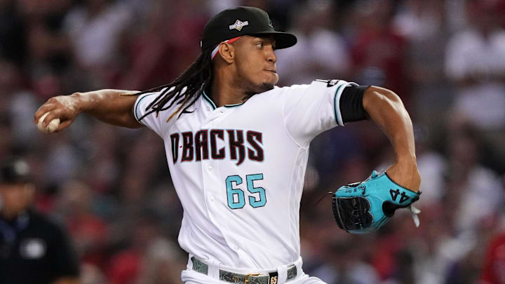 Oct 21, 2023; Phoenix, Arizona, USA; Arizona Diamondbacks relief pitcher Luis Frias (65) throws a pitch against the Philadelphia Phillies in the eighth inning during game five of the NLCS for the 2023 MLB playoffs at Chase Field. Mandatory Credit: Joe Camporeale-Imagn Images