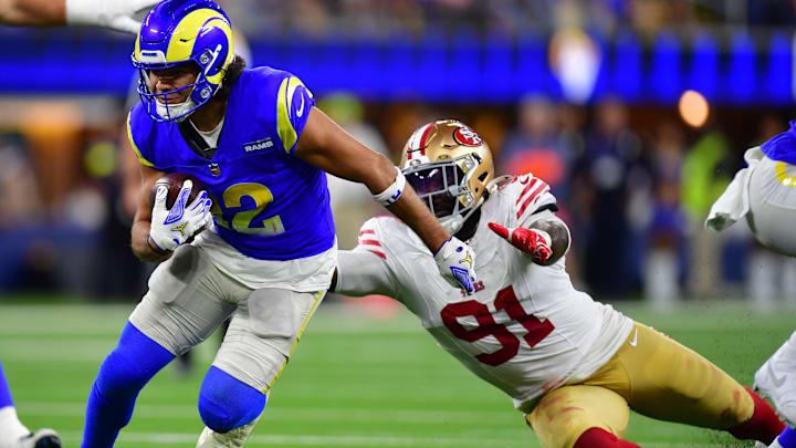 Oct 2, 2025; Inglewood, California, USA; Los Angeles Rams wide receiver Puka Nacua (12) makes a catch past San Francisco 49ers defensive tackle Sam Okuayinonu (91) during the second half at SoFi Stadium. Mandatory Credit: Gary A. Vasquez-Imagn Images Oct 2, 2025; Inglewood, California, USA; Los Angeles Rams wide receiver Puka Nacua (12) makes a catch past San Francisco 49ers defensive tackle Sam Okuayinonu (91) during the second half at SoFi Stadium. Mandatory Credit: Gary A. Vasquez-Imagn Images
