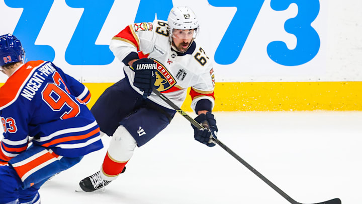 Jun 14, 2025; Edmonton, Alberta, CAN; Florida Panthers center Brad Marchand (63) skates with the puck against Edmonton Oilers center Ryan Nugent-Hopkins (93) during the second period in game five of the 2025 Stanley Cup Final at Rogers Place. Mandatory Credit: Sergei Belski-Imagn Images Jun 14, 2025; Edmonton, Alberta, CAN; Florida Panthers center Brad Marchand (63) skates with the puck against Edmonton Oilers center Ryan Nugent-Hopkins (93) during the second period in game five of the 2025 Stanley Cup Final at Rogers Place. Mandatory Credit: Sergei Belski-Imagn Images