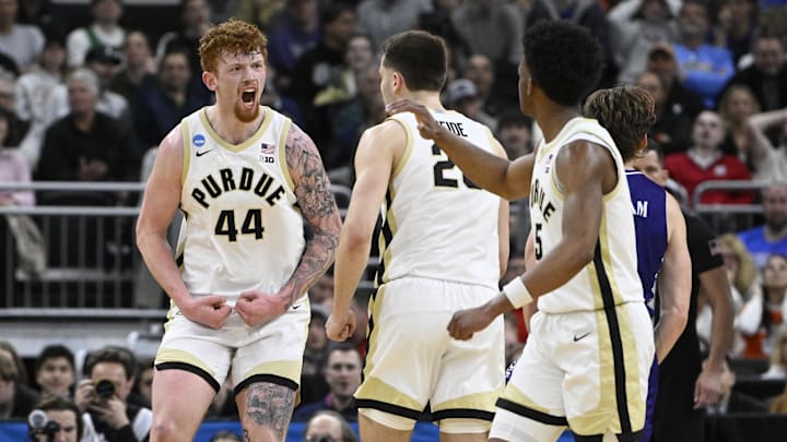 Purdue Boilermakers center Will Berg (44) celebrates with teammates 