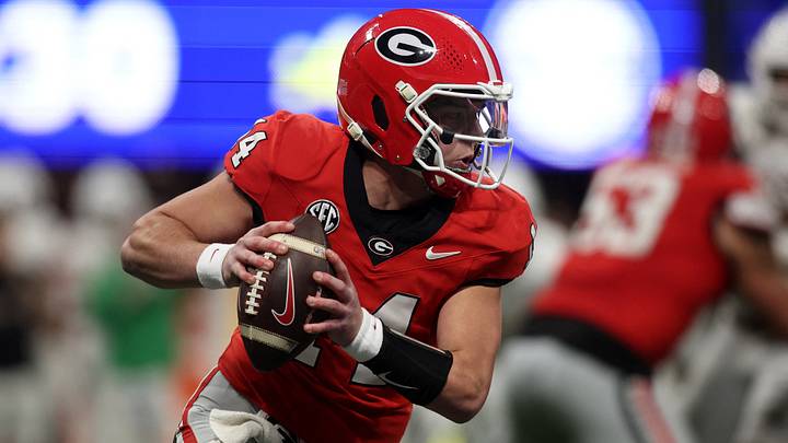 Dec 7, 2024; Atlanta, GA, USA; Georgia Bulldogs quarterback Gunner Stockton (14) drops back to pass against the Texas Longhorns during the second half in the 2024 SEC Championship game at Mercedes-Benz Stadium. Mandatory Credit: Brett Davis-Imagn Images