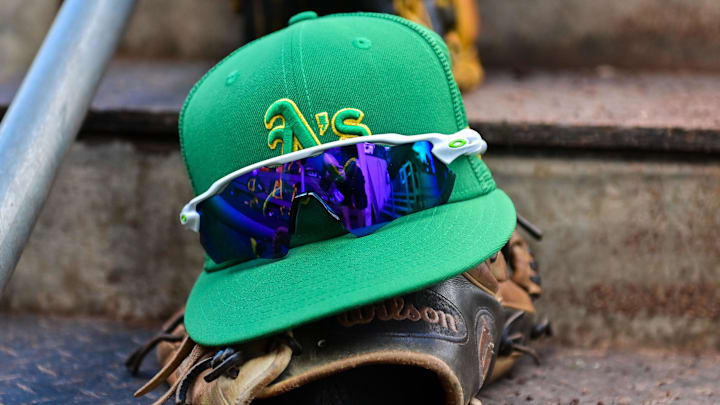 Mar 2, 2023; Mesa, Arizona, USA; General view of an Oakland Athletics hat, glove glasses prior to a Spring Training game against the Chicago Cubs at Sloan Park. Mandatory Credit: Matt Kartozian-Imagn Images Mar 2, 2023; Mesa, Arizona, USA; General view of an Oakland Athletics hat, glove glasses prior to a Spring Training game against the Chicago Cubs at Sloan Park. Mandatory Credit: Matt Kartozian-Imagn Images