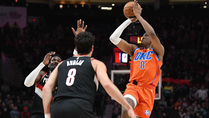 Nov 1, 2024; Portland, Oregon, USA; Oklahoma City Thunder guard/forward Jalen Williams (8) shoots over Portland Trailblazers center Deandre Ayton (2) and forward Deni Avdija (8) during the second quarter at Moda Center. Mandatory Credit: Brian Murphy-Imagn Images