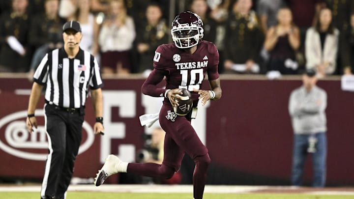 Nov 16, 2024; College Station, Texas, USA; Texas A&M Aggies quarterback Marcel Reed (10) runs the ball during the first half against the New Mexico State Aggies at Kyle Field. Mandatory Credit: Maria Lysaker-Imagn Images 