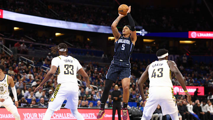 Orlando Magic forward Paolo Banchero (5) shoots the ball over Indiana Pacers center Myles Turner (33) and forward Pascal Siakam (43) in the first quarter at Kia Center.