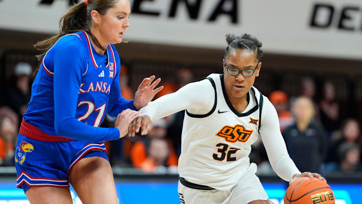 Oklahoma State Cowgirls guard Stailee Heard (32) tries to get past Kansas Jayhawks guard Elle Evans (21) during a women's BIG 12 basketball game between the Oklahoma State University Cowgirls (OSU) and the Kansas Jayhawks at Gallagher-Iba Arena in Stillwater, Okla., Saturday, Jan. 4, 2025.