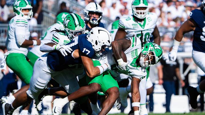 Penn State Nittany Lions cornerback Josiah Zayas tackles Marshall running back Jo'Shon Barbie in a game at Beaver Stadium. Penn State Nittany Lions cornerback Josiah Zayas tackles Marshall running back Jo'Shon Barbie in a game at Beaver Stadium.