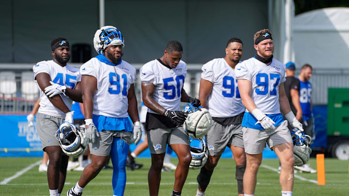 Defensive Lineman Issac Ukwu, Levi Onwuzurike, LB Mitchell Agude, Marcus Davenport and Aidan Hutchinson walk off the field during day two of the Detroit Lions training camp at the Detroit Lions Headquarters in Dearborn, Mich. on Thursday, July 25, 2024.