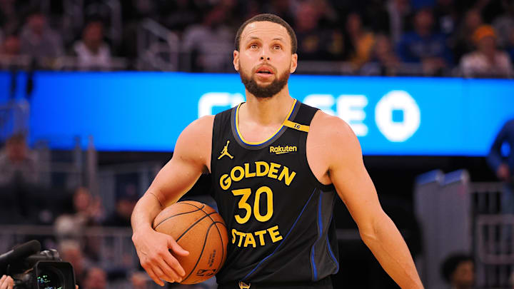 Feb 3, 2025; San Francisco, California, USA; Golden State Warriors guard Stephen Curry (30) holds onto the ball between plays against the Orlando Magic during the fourth quarter at Chase Center. Mandatory Credit: Kelley L Cox-Imagn Images