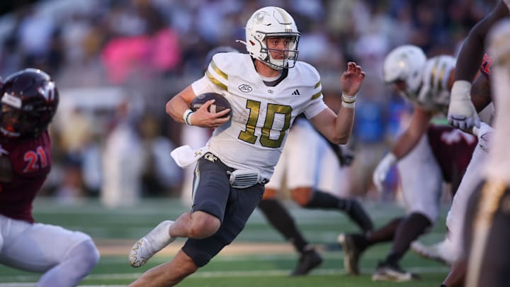 Oct 11, 2025; Atlanta, Georgia, USA; Georgia Tech Yellow Jackets quarterback Haynes King (10) runs the ball for a touchdown against the Virginia Tech Hokies in the fourth quarter at Bobby Dodd Stadium at Hyundai Field. Mandatory Credit: Brett Davis-Imagn Images