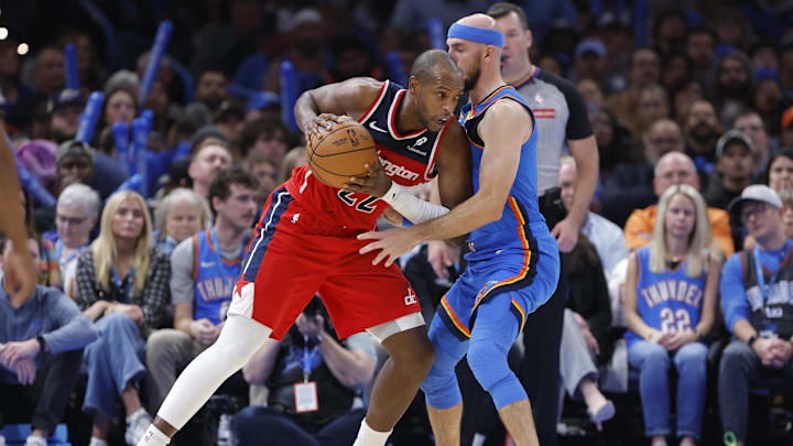 Oct 30, 2025; Oklahoma City, Oklahoma, USA; Washington Wizards forward Khris Middleton (22) drives against Oklahoma City Thunder guard Alex Caruso (9) during the second half at Paycom Center. Mandatory Credit: Alonzo Adams-Imagn Images Oct 30, 2025; Oklahoma City, Oklahoma, USA; Washington Wizards forward Khris Middleton (22) drives against Oklahoma City Thunder guard Alex Caruso (9) during the second half at Paycom Center. Mandatory Credit: Alonzo Adams-Imagn Images