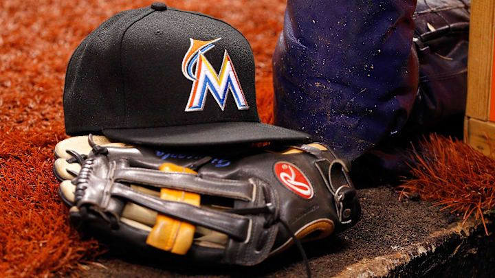 Jun 4, 2014; St. Petersburg, FL, USA; Miami Marlins hat and glove lay in the dugout against the Tampa Bay Rays at Tropicana Field.