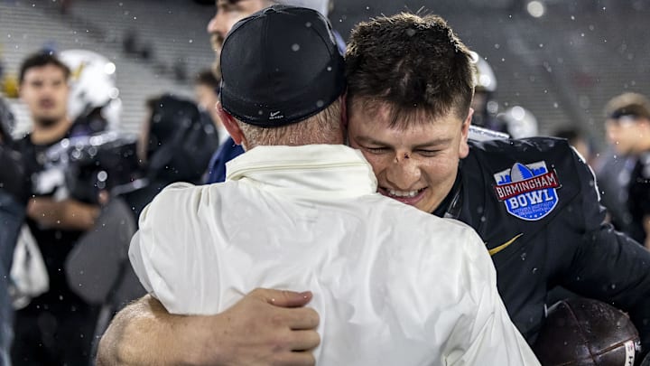 Dec 27, 2024; Birmingham, AL, USA;  Vanderbilt Commodores quarterback Diego Pavia, right, celebrates a win against the Georgia Tech Yellow Jacketsafter the 2024 Birmingham Bowl at Protective Stadium