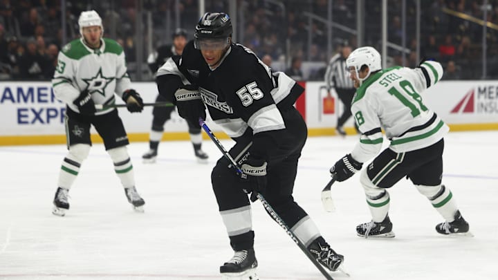 Dec 4, 2024; Los Angeles, California, USA; Los Angeles Kings right wing Quinton Byfield (55) reaches for the puck against the Dallas Stars during the second period of a hockey game at Crypto.com Arena. Mandatory Credit: Jessica Alcheh-Imagn Images