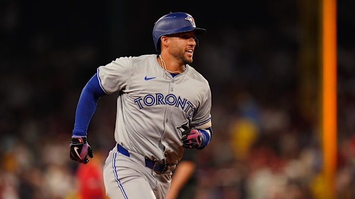 Aug 26, 2024; Boston, Massachusetts, USA; Toronto Blue Jays right fielder George Springer (4) hits a three run home run against the Boston Red Sox in the fifth inning at Fenway Park. Mandatory Credit: David Butler II-USA TODAY Sports