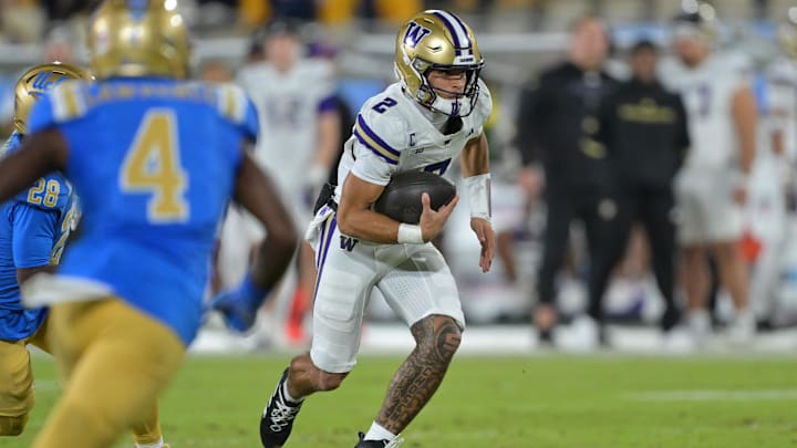 Nov 22, 2025; Pasadena, California, USA;  Washington Huskies quarterback Demond Williams Jr. (2) runs for a touchdown against the UCLA Bruins at the Rose Bowl. Mandatory Credit: Jayne Kamin-Oncea-Imagn Images